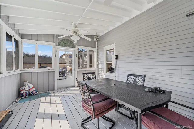 a view of a house with wooden deck