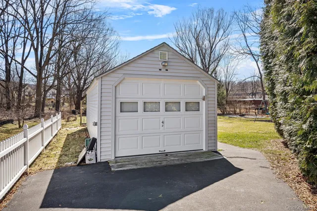 a view of yard with swimming pool and green space