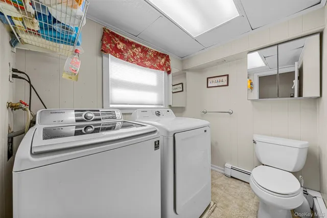 a view of bathroom with a toilet sink and a mirror