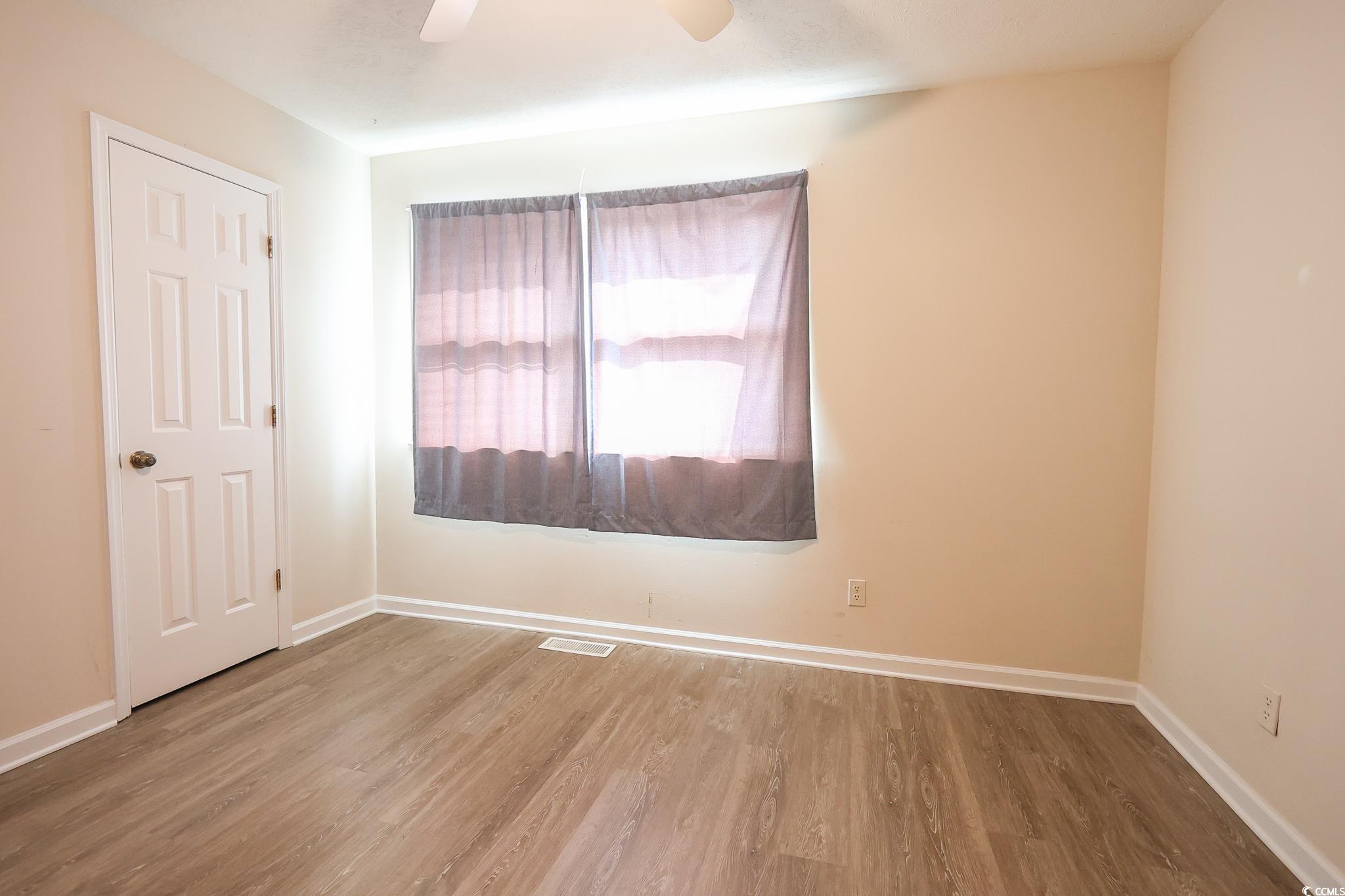 1025 Carolina Road, Unit O4 Conway, SC 29526 - Photo 13 of 22 Empty room featuring visible vents, baseboards, an