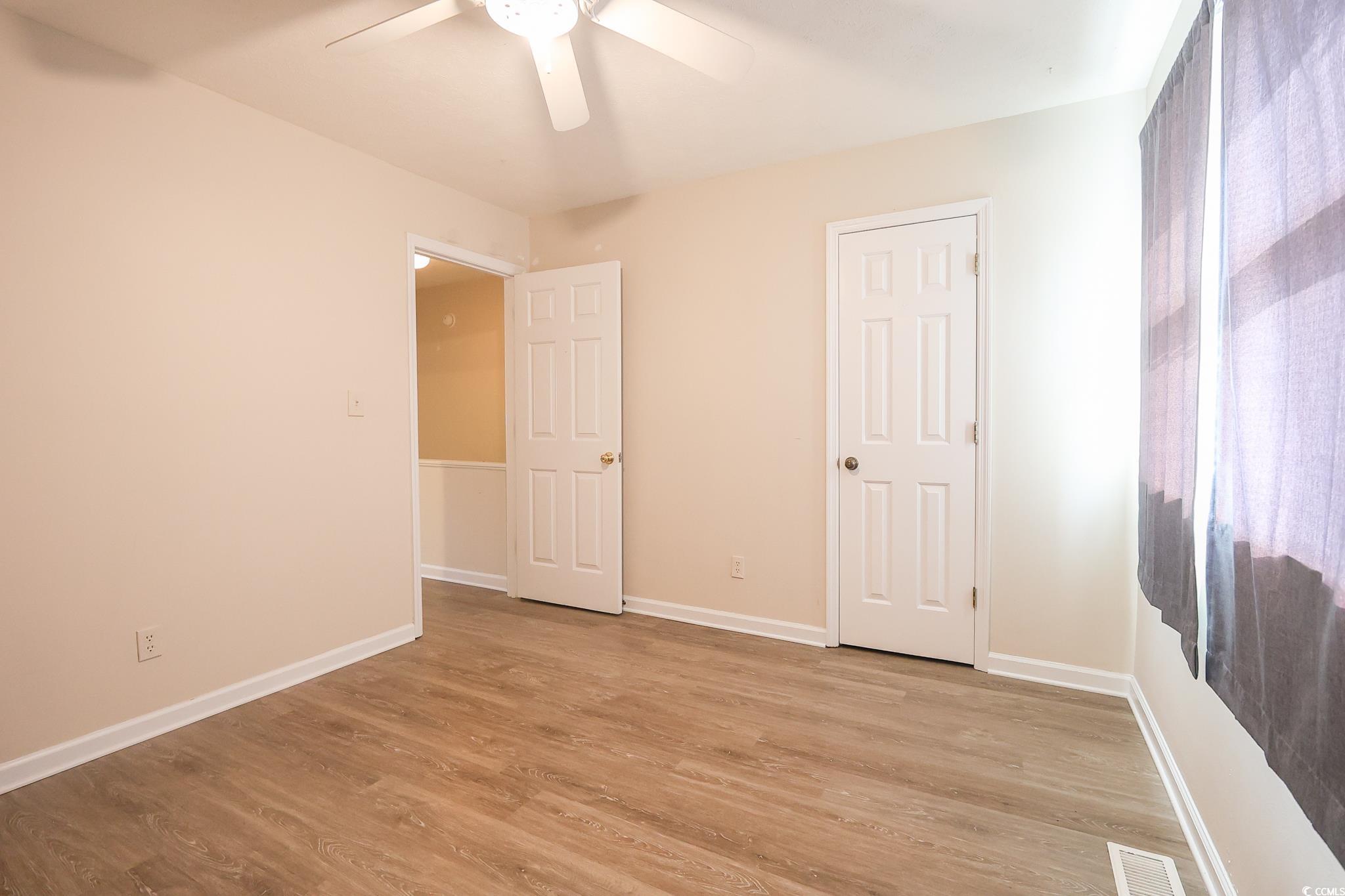 1025 Carolina Road, Unit O4 Conway, SC 29526 - Photo 14 of 22 Unfurnished bedroom featuring light wood-type floo