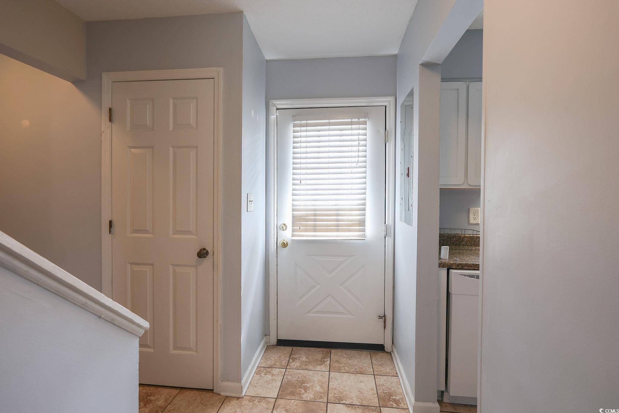 1025 Carolina Road, Unit O4 Conway, SC 29526 - Photo 18 of 22 Doorway featuring baseboards and light tile patter