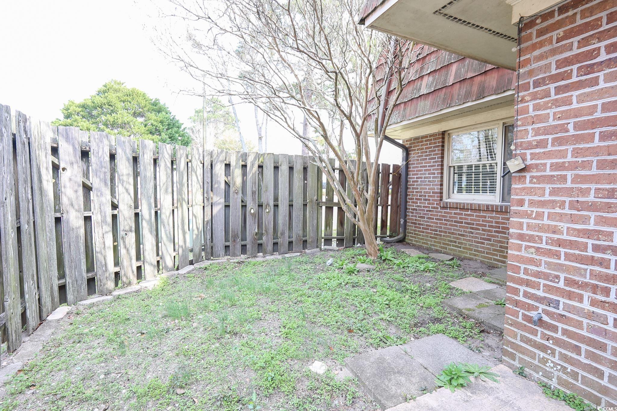 1025 Carolina Road, Unit O4 Conway, SC 29526 - Photo 20 of 22 View of yard with a fenced backyard