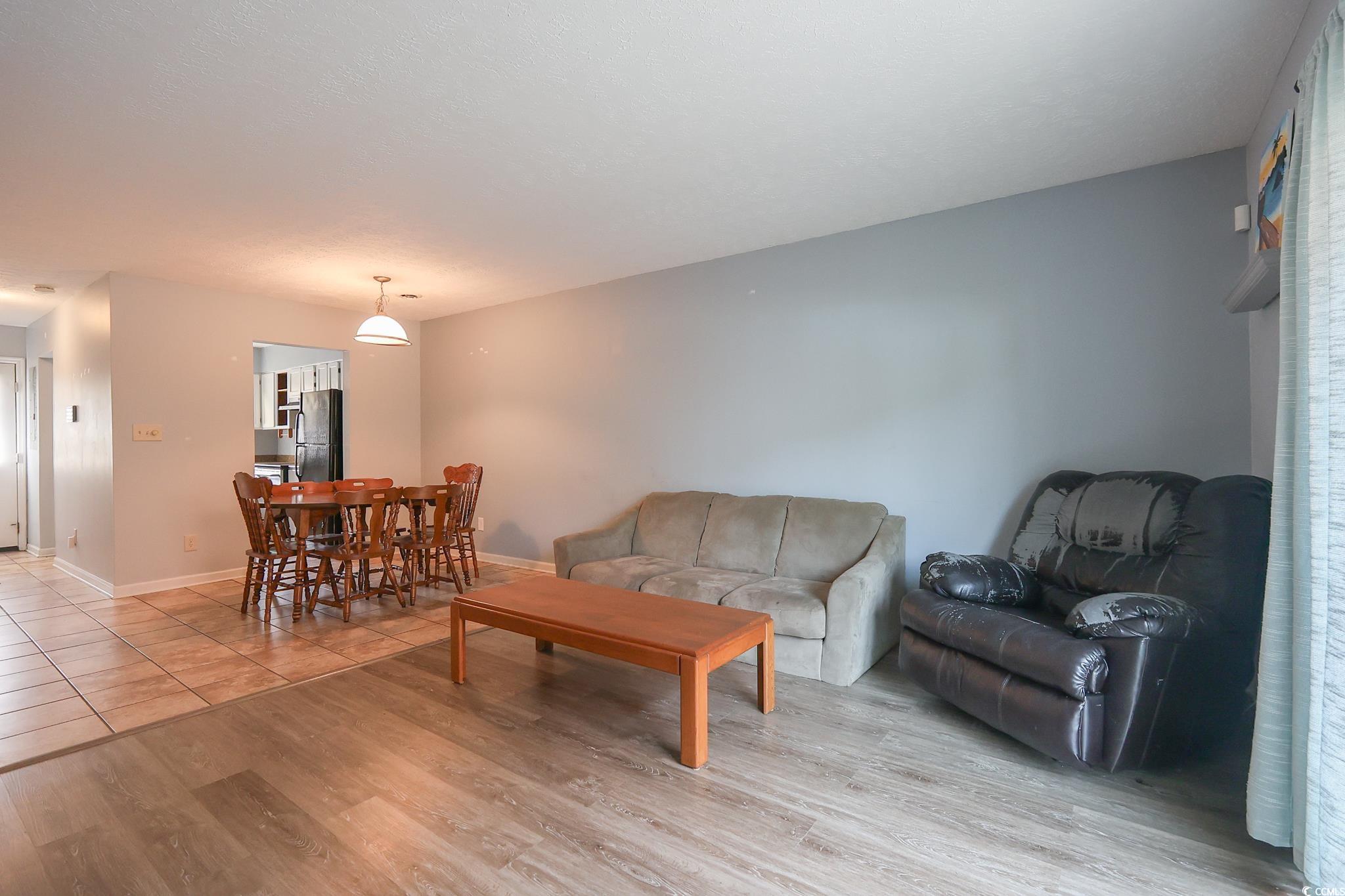 1025 Carolina Road, Unit O4 Conway, SC 29526 - Photo 2 of 22 Living area featuring light wood-style flooring an