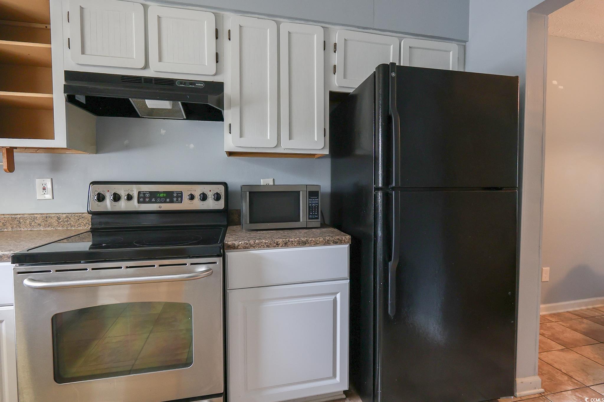 1025 Carolina Road, Unit O4 Conway, SC 29526 - Photo 6 of 22 Kitchen featuring baseboards, tile patterned floor