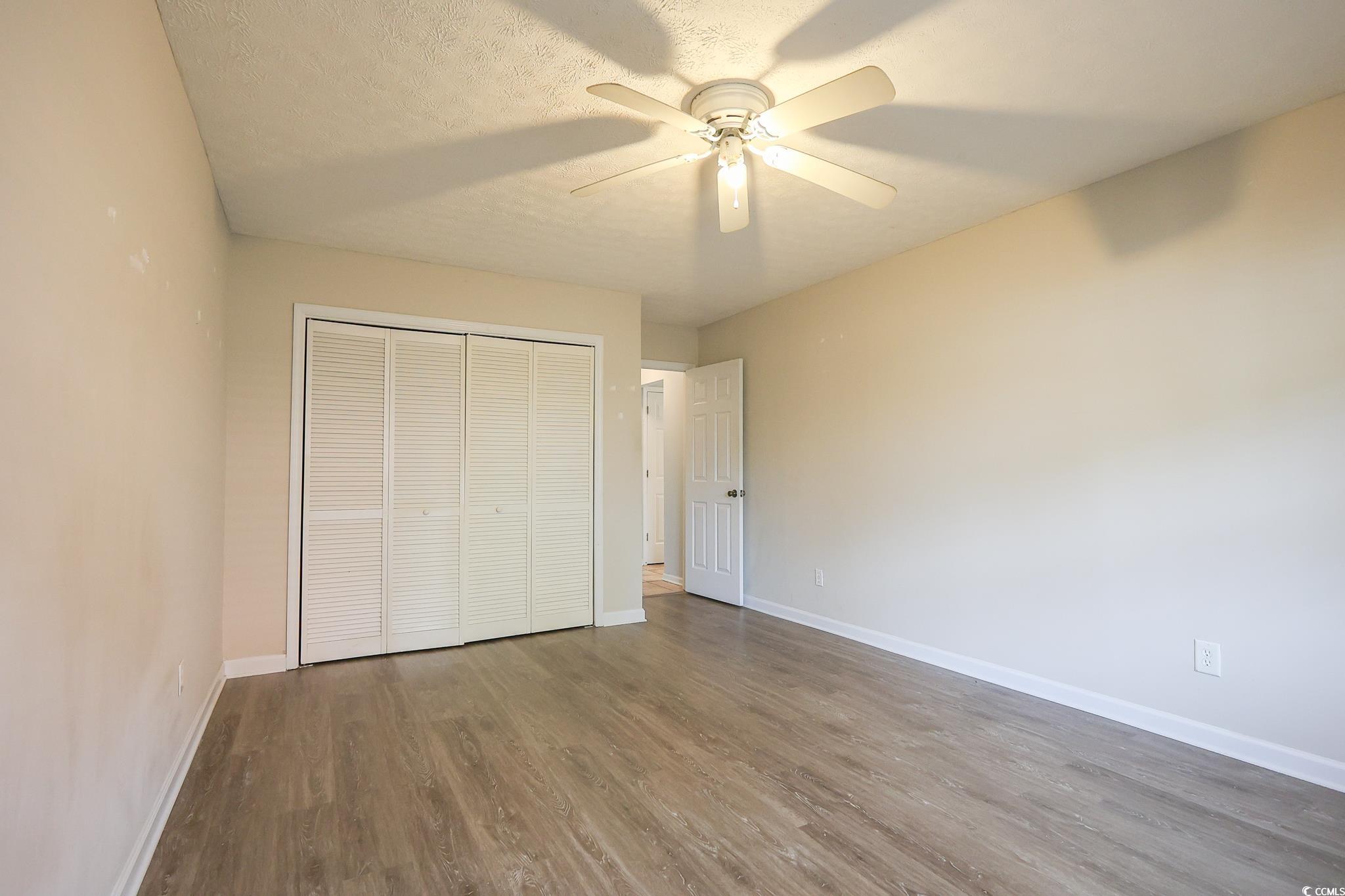 1025 Carolina Road, Unit O4 Conway, SC 29526 - Photo 8 of 22 Unfurnished bedroom with a closet, baseboards, a t