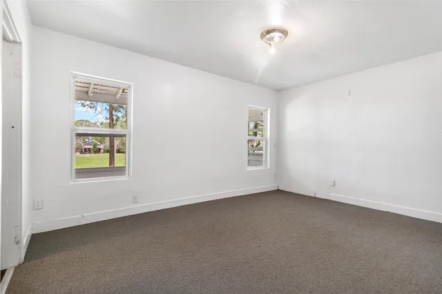 an empty room with windows