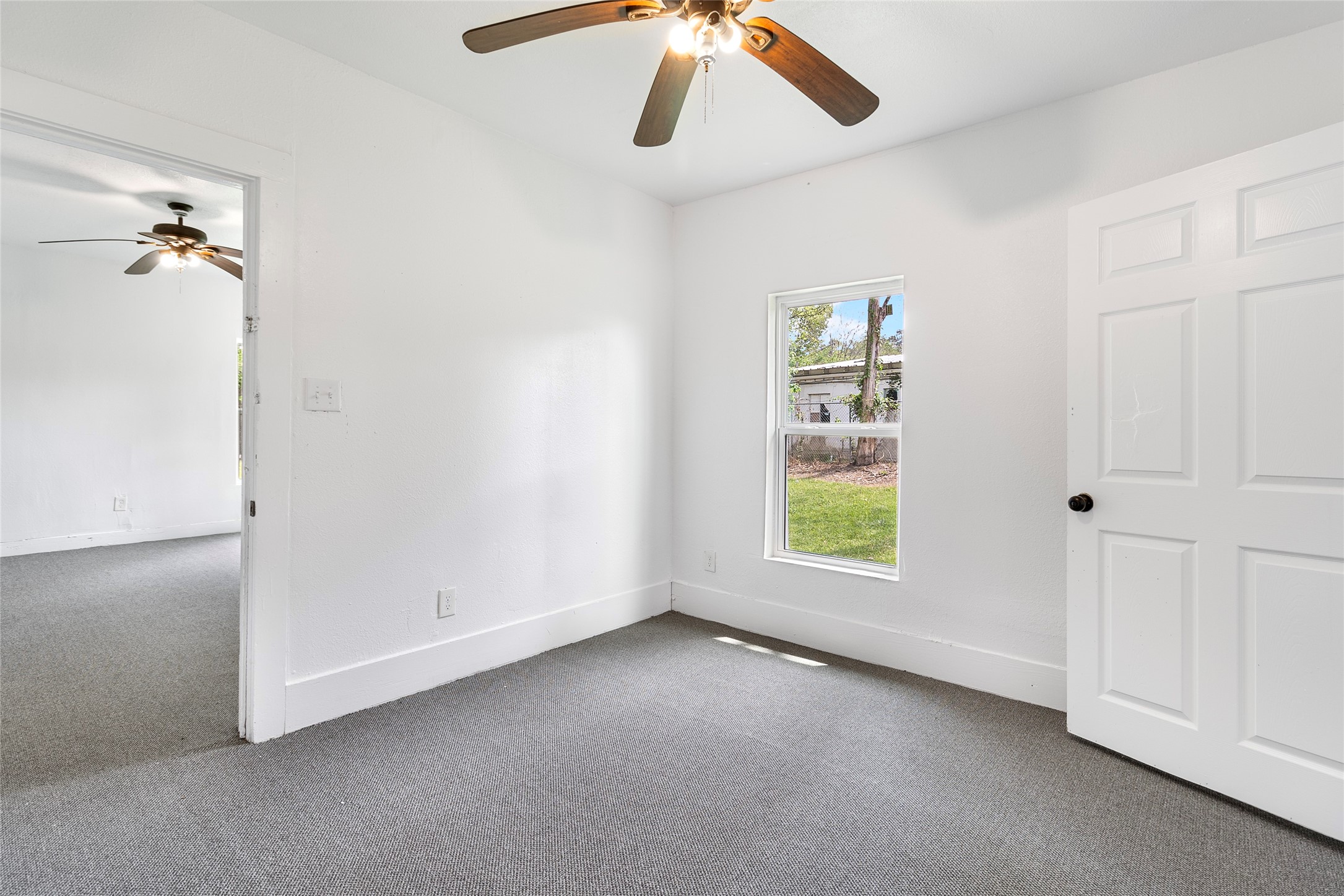 725 South Washington Avenue Livingston, TX 77351 - Photo 14 of 17 wooden floor in an empty room with a window