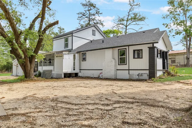 a house with a tree in front of it