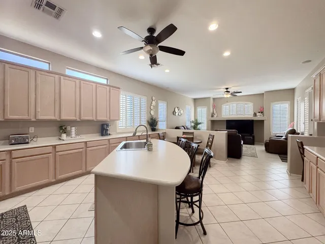 a kitchen with sink cabinets and window
