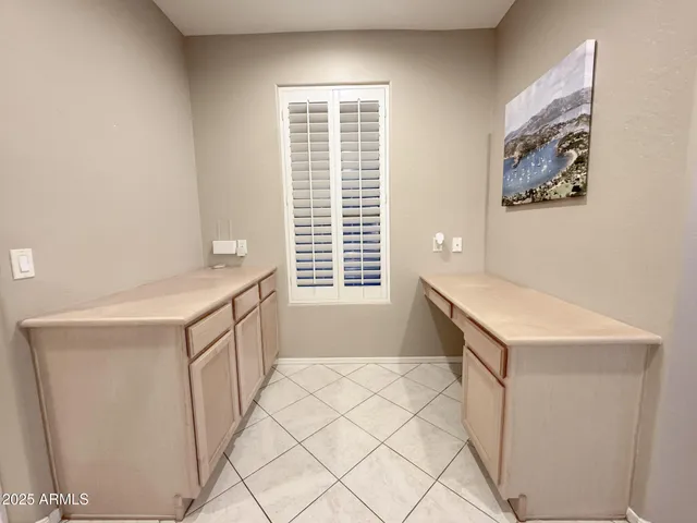 a bathroom with a sink a vanity and a window