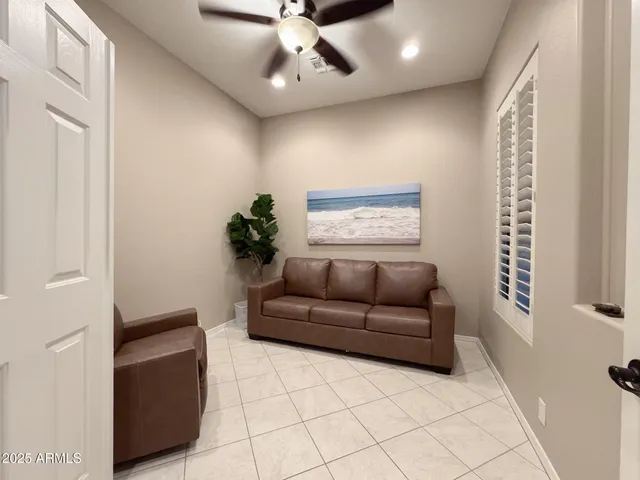 a living room with furniture and a window