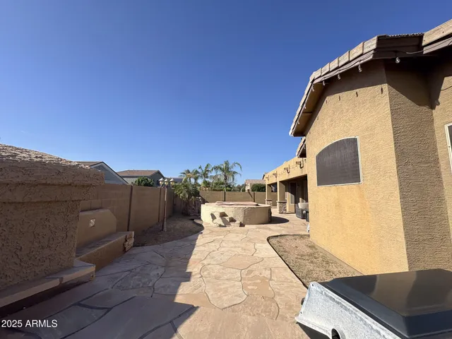 a view of a back yard of the house