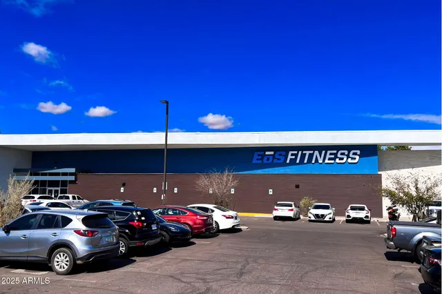 a picture of a building with a bench