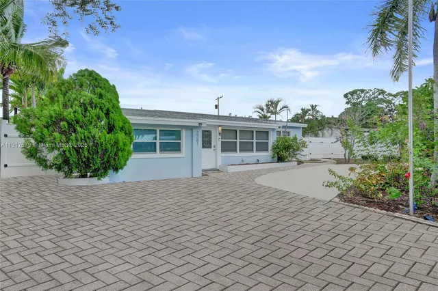 a house view with a garden space