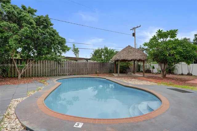 a view of a swimming pool with a patio
