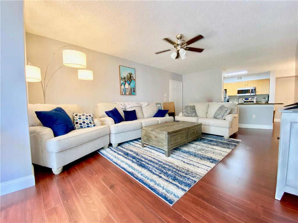 3207 Clint Moore Road, Unit 104 Boca Raton, FL 33496 - Photo 5 of 27 Living Room View to Kitchen and Entrance