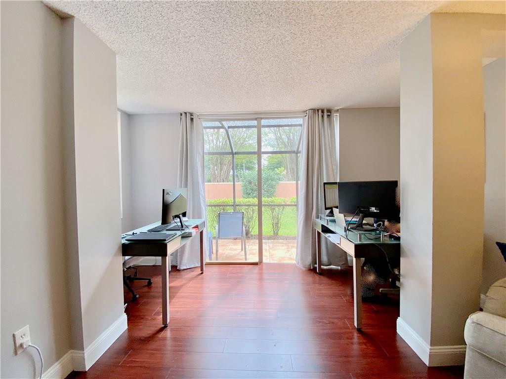 3207 Clint Moore Road, Unit 104 Boca Raton, FL 33496 - Photo 7 of 27 Living Room to Patio