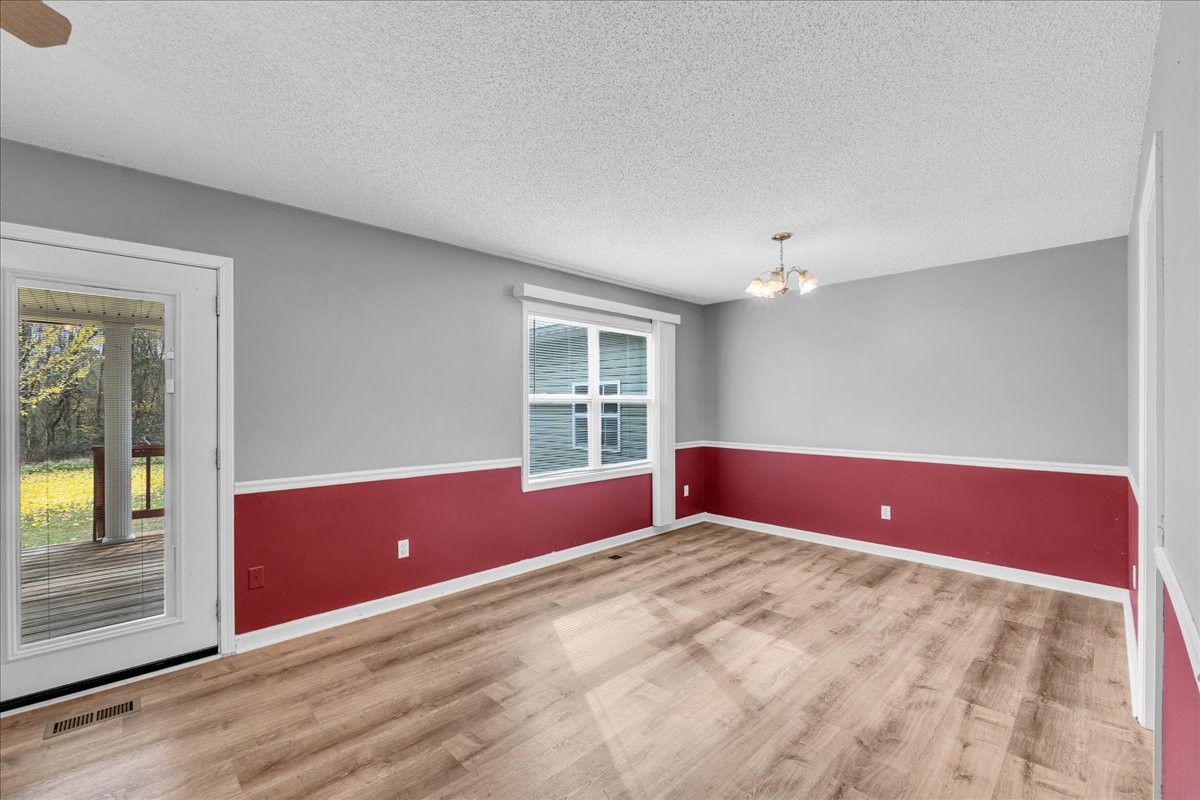 99 Arrowhead Drive Manchester, TN 37355 - Photo 18 of 39 a view of wooden floor and windows in a room