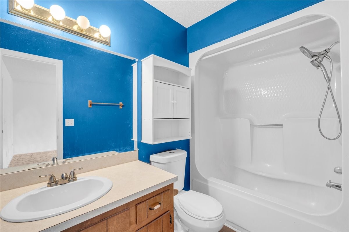 99 Arrowhead Drive Manchester, TN 37355 - Photo 23 of 39 a bathroom with a sink a toilet and shower