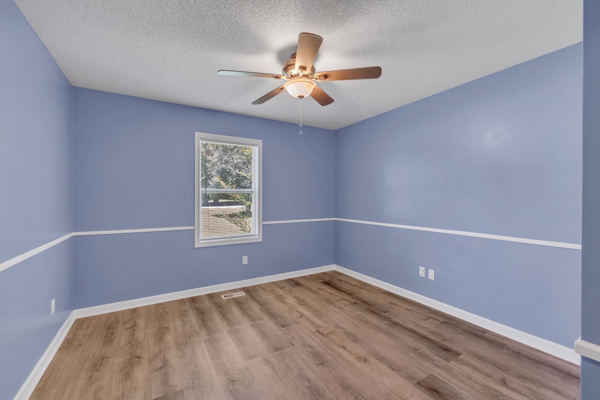 99 Arrowhead Drive Manchester, TN 37355 - Photo 24 of 39 wooden floor in an empty room with a window