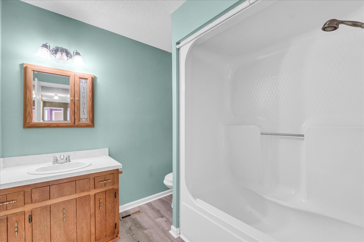 99 Arrowhead Drive Manchester, TN 37355 - Photo 27 of 39 a bathroom with a bathtub and a shower