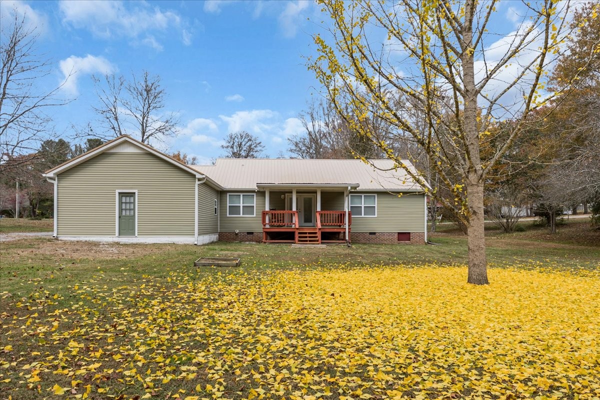 99 Arrowhead Drive Manchester, TN 37355 - Photo 31 of 39 a front view of house with yard and trees in the background