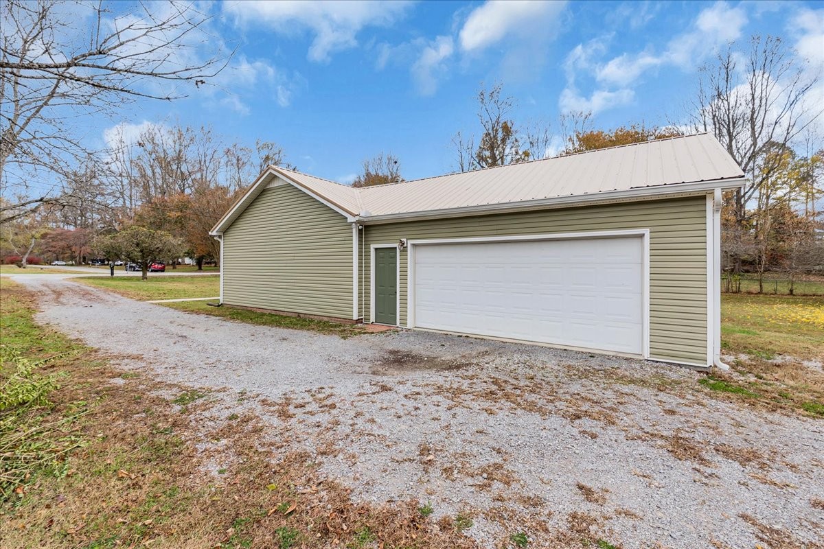 99 Arrowhead Drive Manchester, TN 37355 - Photo 38 of 39 a view of a house with a yard and garage