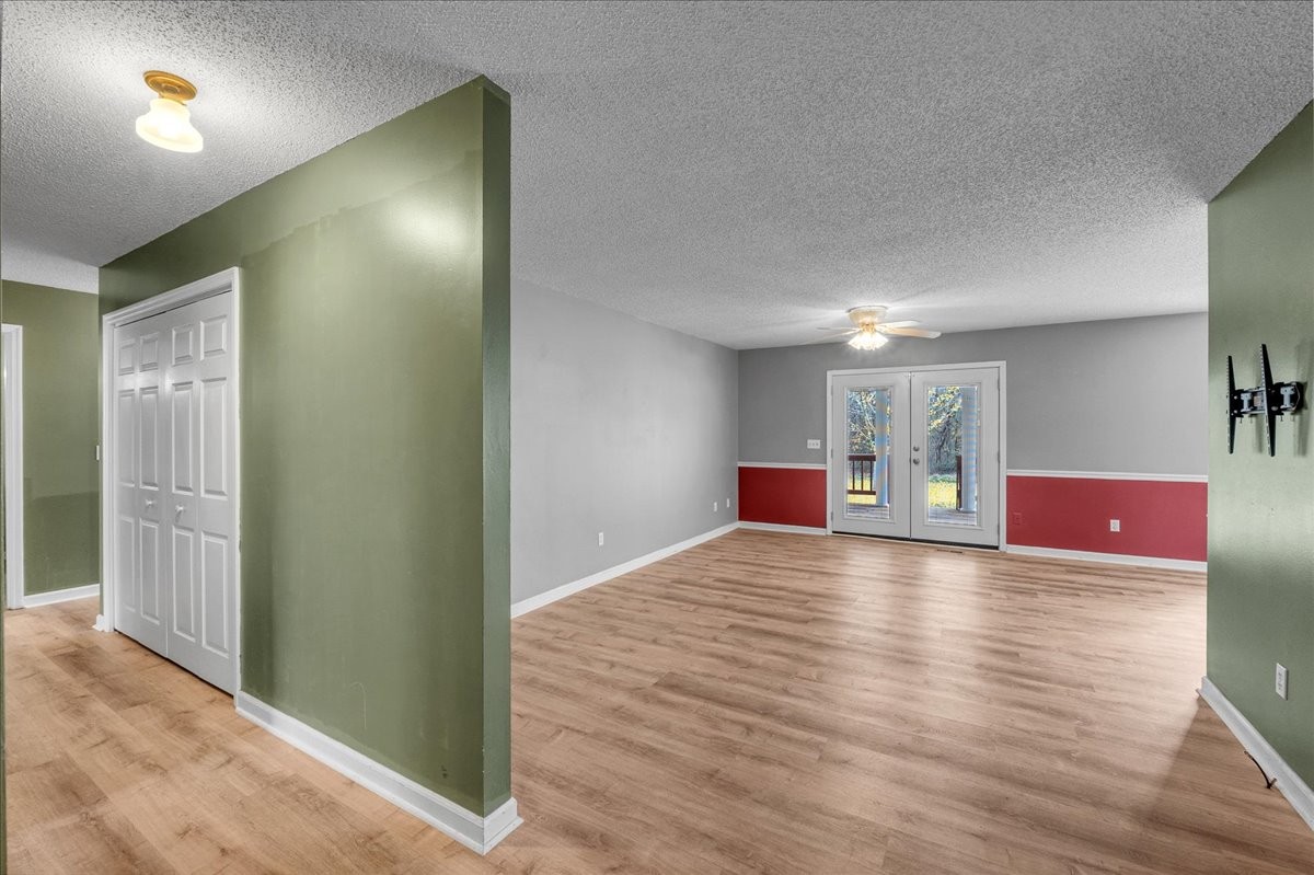 99 Arrowhead Drive Manchester, TN 37355 - Photo 9 of 39 a view of a room with wooden floor and staircase