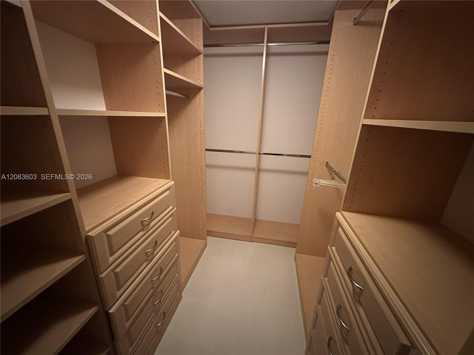 400 Alton Road, Unit 901 Miami Beach, FL 33139 - Photo 14 of 24 Primary closet is fully built out.