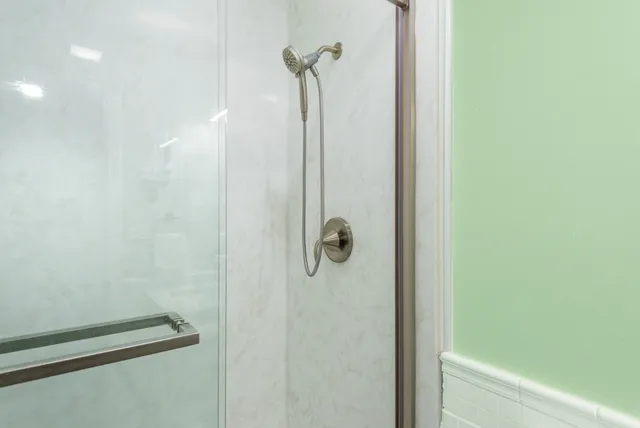 a view of a hallway with bathroom