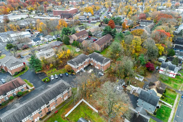 an aerial view of residential houses with outdoor space