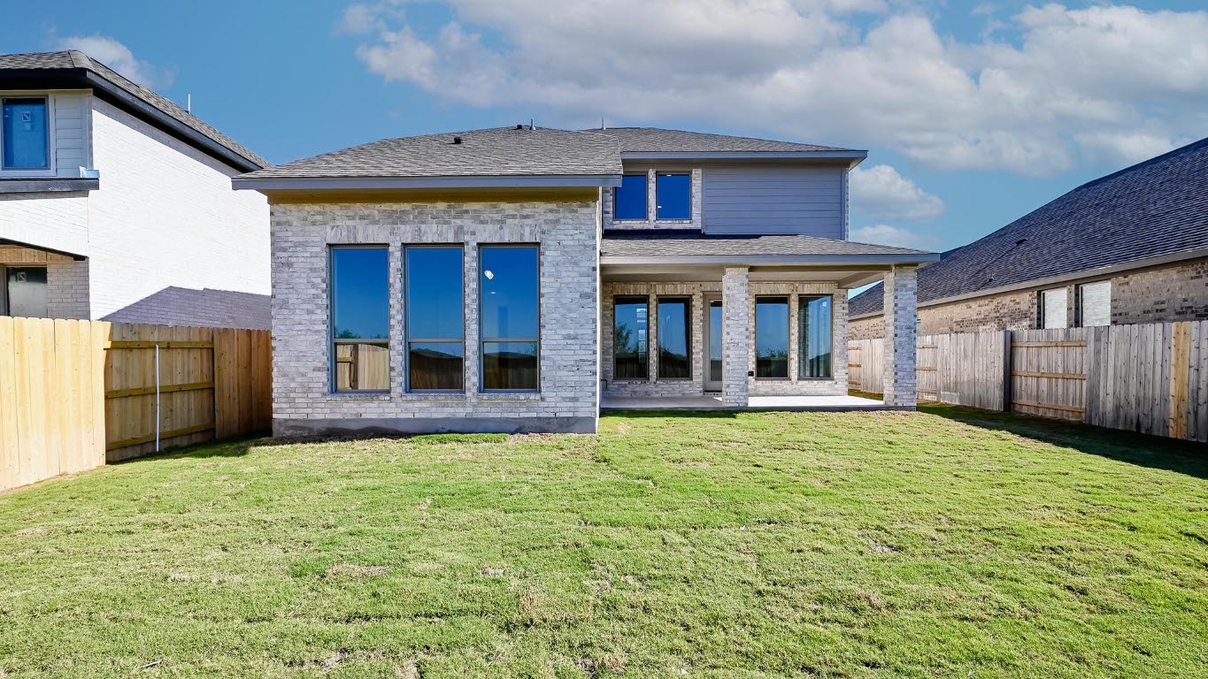 580 Bay Breeze Drive Kyle, TX 78640 - Photo 13 of 35 a view of a house with pool and a yard