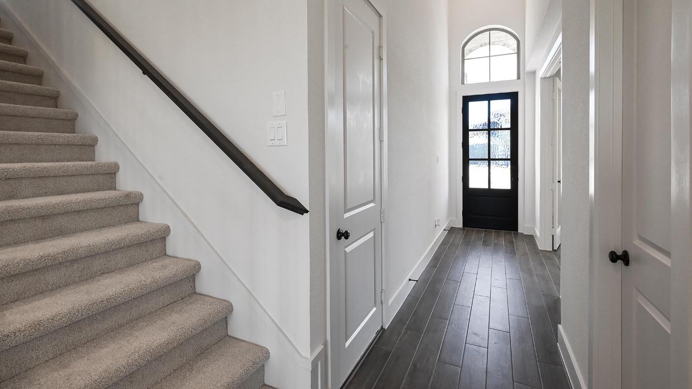 580 Bay Breeze Drive Kyle, TX 78640 - Photo 14 of 35 a view of entryway and hall with wooden floor