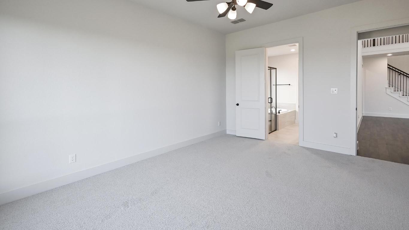 580 Bay Breeze Drive Kyle, TX 78640 - Photo 18 of 35 an empty room with a chandelier fan