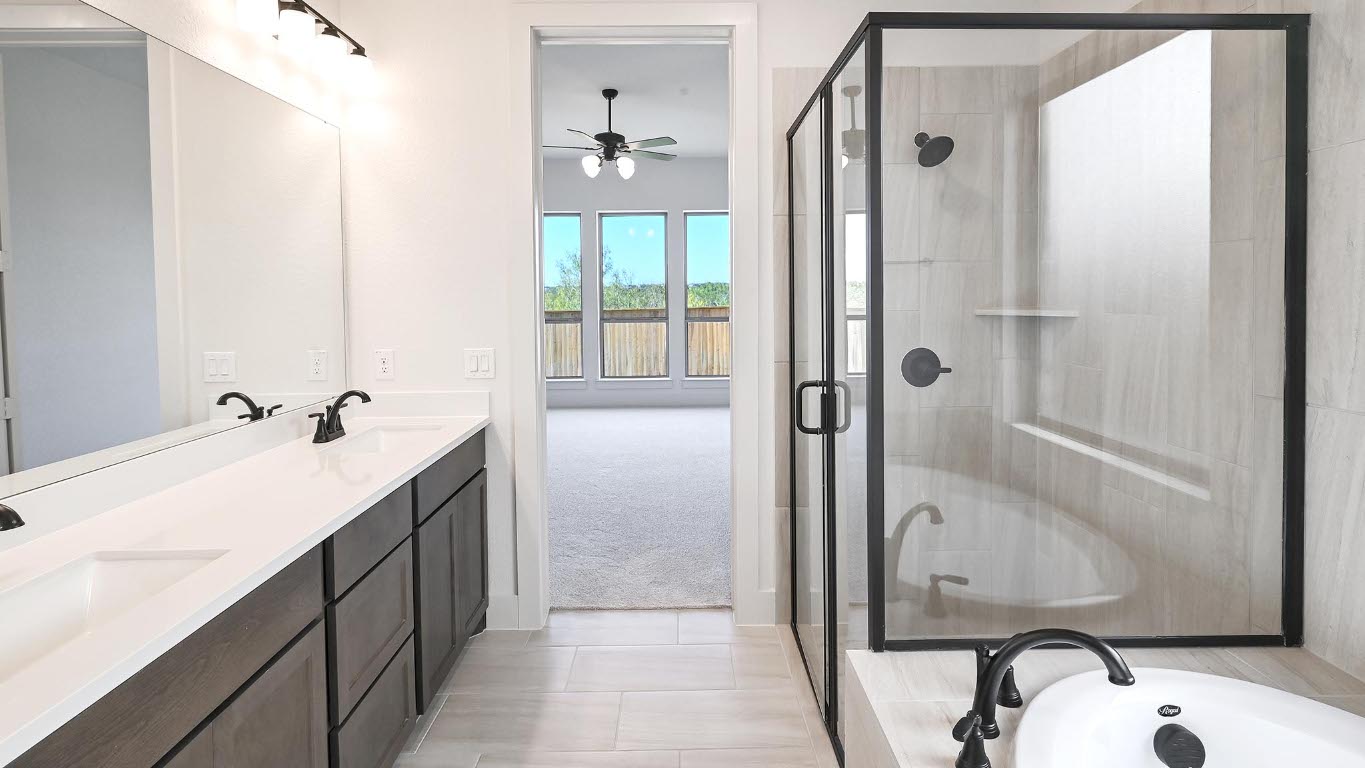 580 Bay Breeze Drive Kyle, TX 78640 - Photo 19 of 35 a bathroom with a sink and a mirror