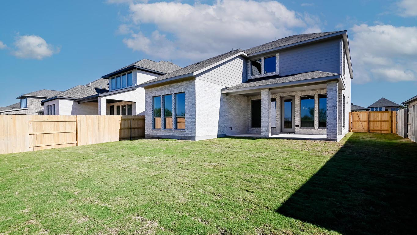 580 Bay Breeze Drive Kyle, TX 78640 - Photo 24 of 35 a front view of a house with a yard