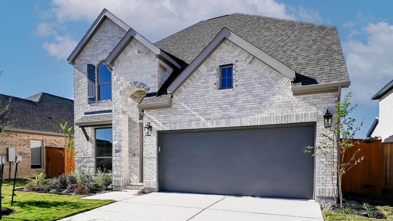 580 Bay Breeze Drive Kyle, TX 78640 - Photo 3 of 35 a front view of a house with garden