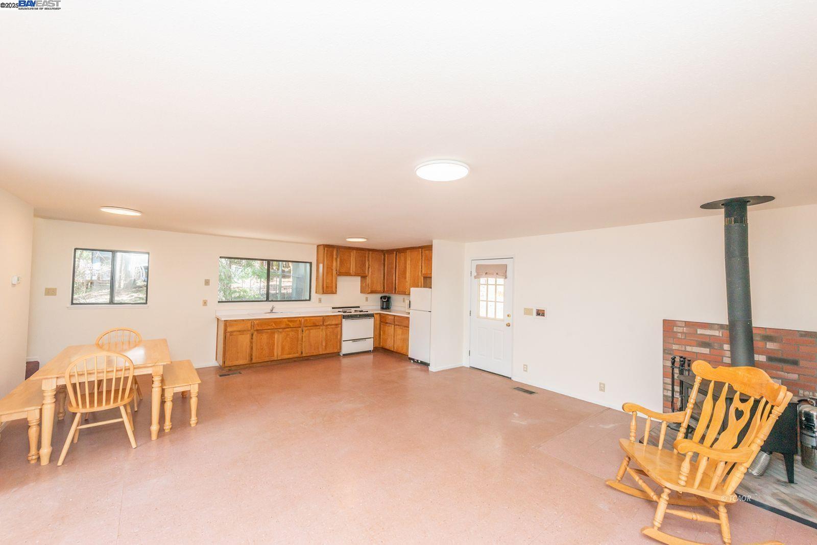 121 Mountain Aire Lane Trinity Center, CA 96091 - Photo 18 of 51 a living room with furniture and a dining table with chair