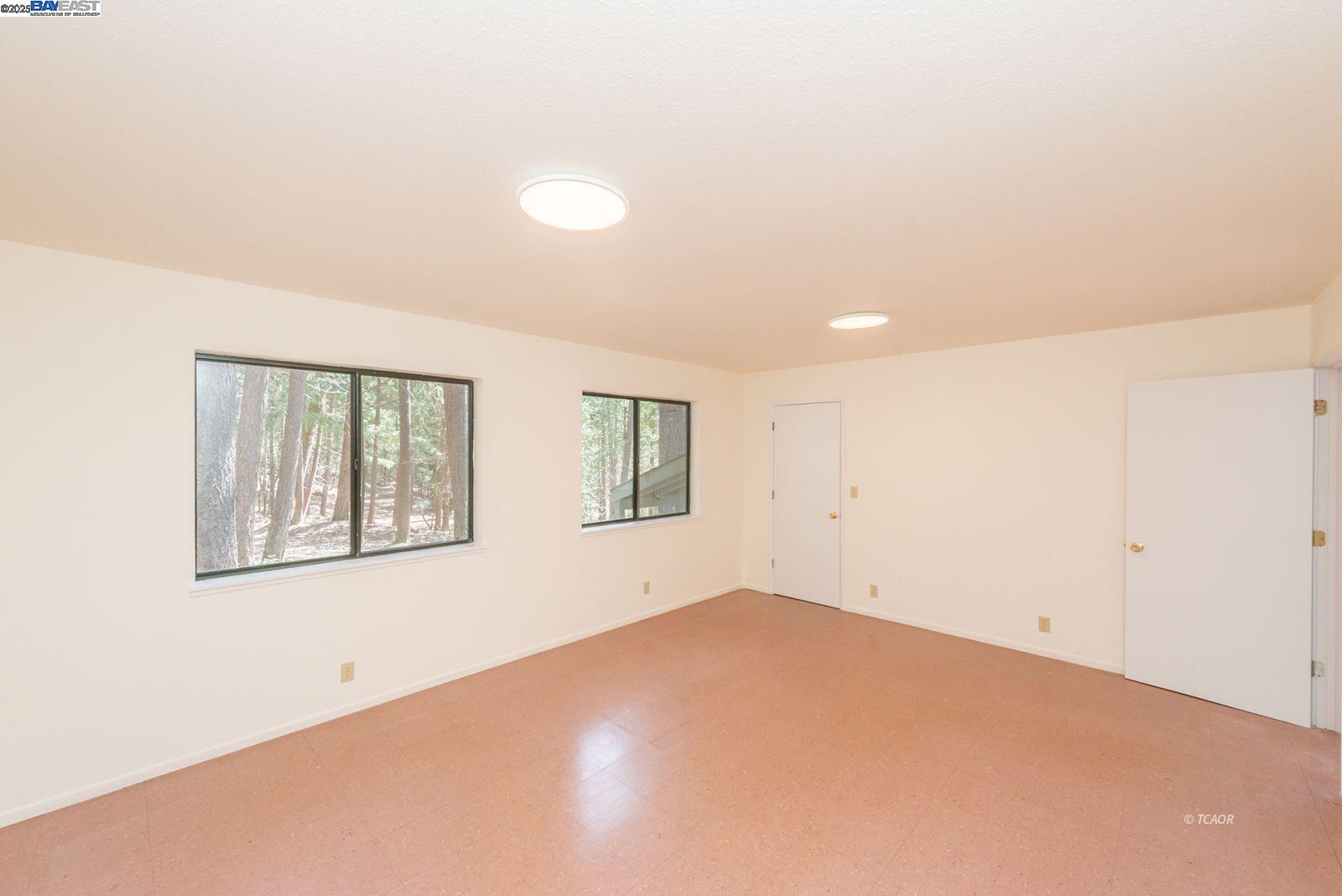 121 Mountain Aire Lane Trinity Center, CA 96091 - Photo 21 of 51 an empty room with windows