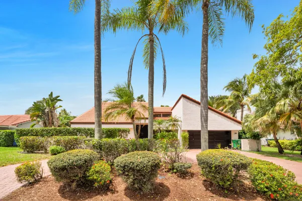 a backyard of a house with outdoor seating