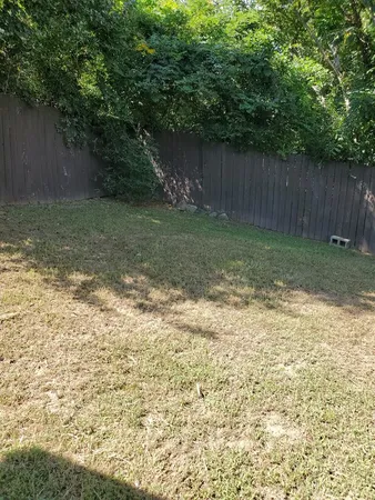 a backyard of a house with lots of green space