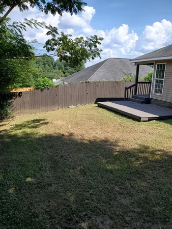 a swimming pool with wooden fence