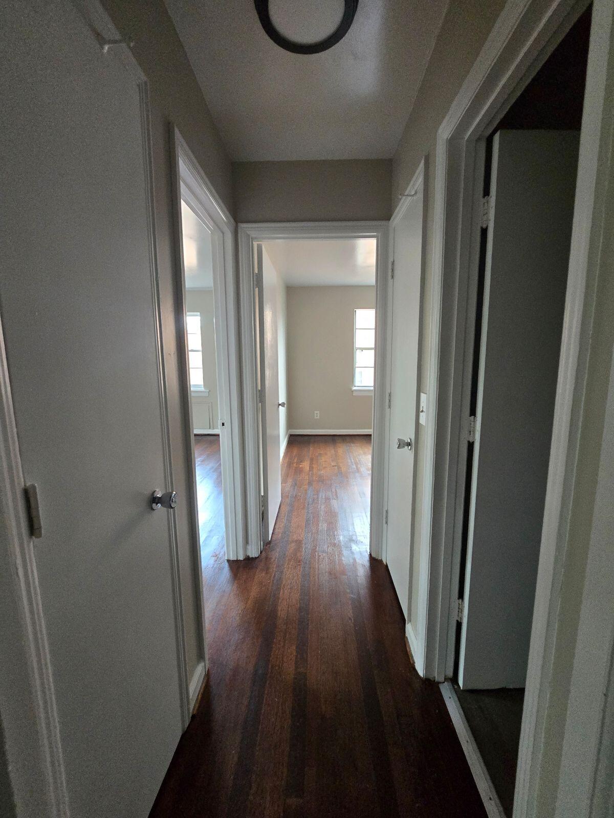 1711 Westover Avenue Southwest, Unit 12 Roanoke, VA 24015 - Photo 4 of 10 a view of a hallway with wooden floor and front door