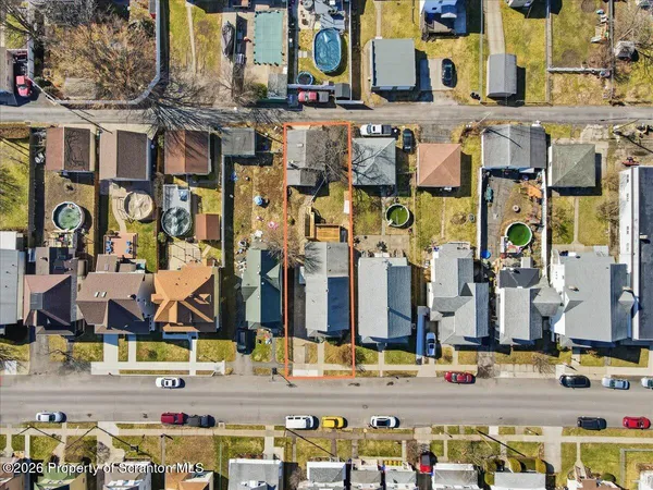 an aerial view of residential house with parking space