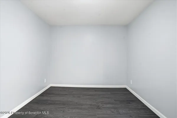 a view of a house with wooden floor and a sink
