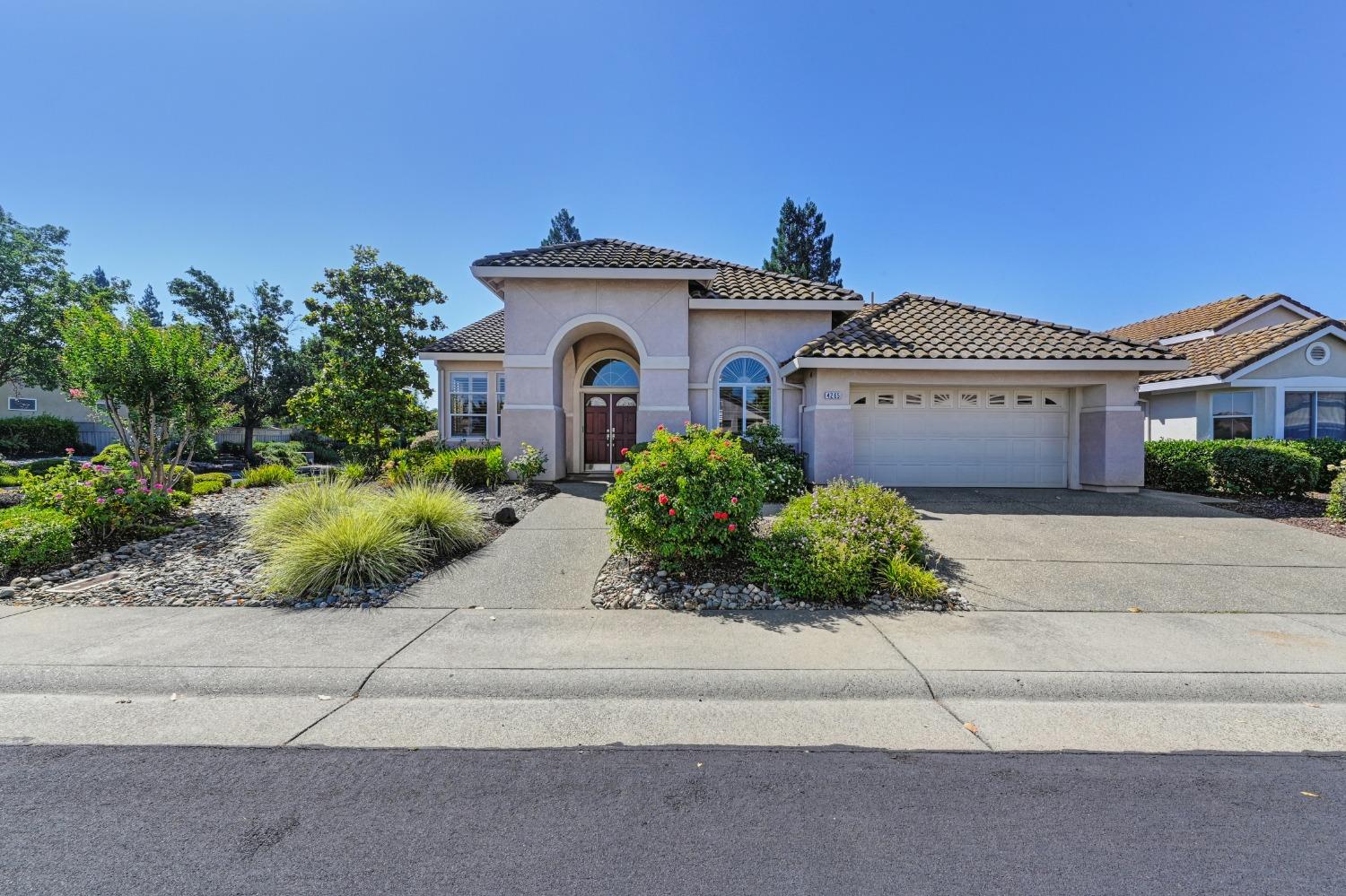 4265 Rose Creek Road Roseville, CA 95747 - Photo 1 of 1 a front view of a house with a garden