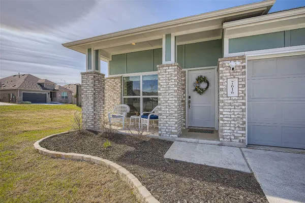 a view of a brick house with an outdoor space