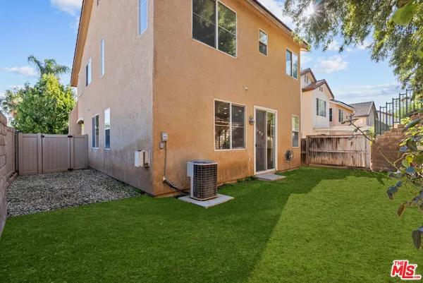 an aerial view of residential house with outdoor space