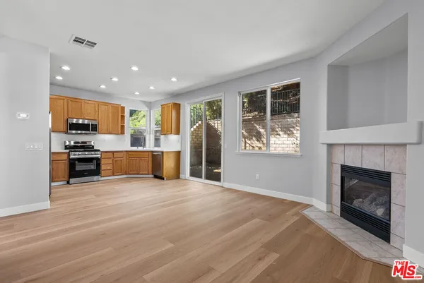 a view of kitchen with furniture and a fireplace